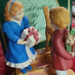 Avon 1984 "Joy of Giving" Porcelain Figurine.